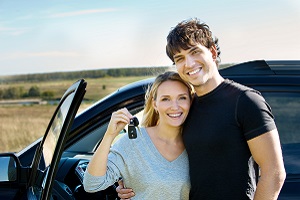 Couple Standing Outside of Car with Keys